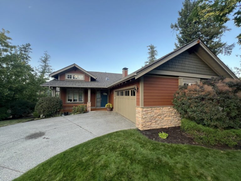 Same Kelowna house after exterior painting, siding and trim refreshed